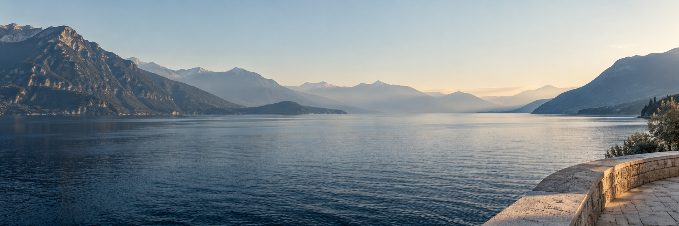 Calm lake water and a distant mountain horizon